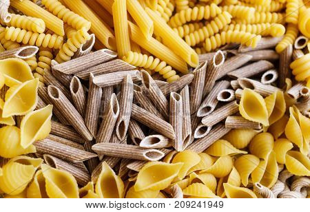 noodles pasta of different kinds scattered on the table.