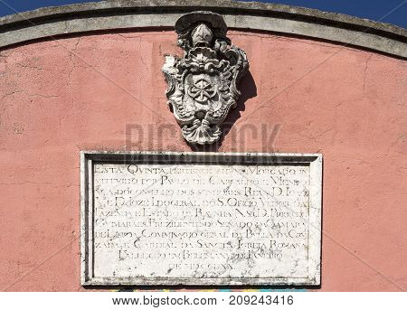 Detail of the coat of arms and 18th century ownership plate on the gate of the former rural farm of the Palace of Marquis de Pombal in Oeiras