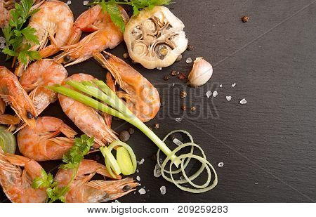 Bbq Grilled Shrimps On Black Slate Serving With Parsley, Leek And Baked Garlic. Barbecue Seefood Con