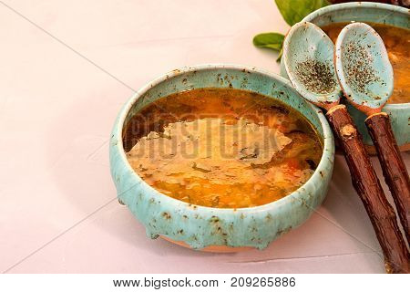 Solyanka Soup With Meat, Smoked Meat, Sausages, Pickled Cucumbers, Tomatoes, Olives, Herbs, Lemon In