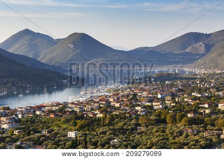 Morning view of Nydri village on Lefkada island with Ithaca and Kefalonia in the distance, Greece.