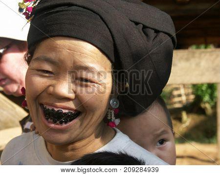 Tai lu Vietnam, 23 April 2010: Beautiful woman with black teeth from Tai lu ethnic group