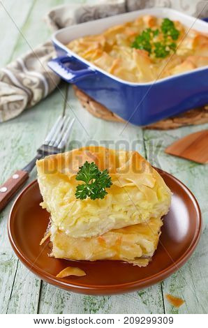 Cheese puff pie from unleavened dough. Georgian cuisine - khachapuri Achma
