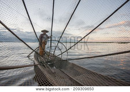 Intha fishermen working in the morning.Inle lake Myanmar
