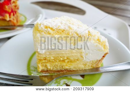 Close up japanese fresh cheese cake on white plate background. Popular favorite japan sweet dessert.