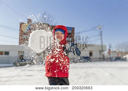 boy throws snowballs. winter fun outdoors. copy space for your text