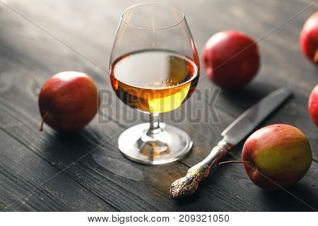 Brandy glass on the dark wooden table