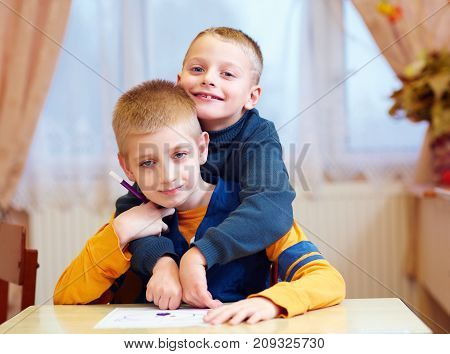 Two Cute Kids, Friends In Rehabilitation School For Kids With Special Needs