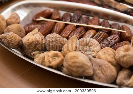 dried figs and dates on a tray