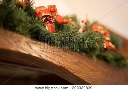 red christmas bow on fireplace to december