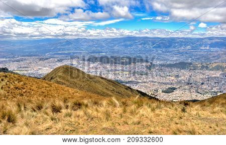 View of the city of Quito and the ecuadorian Andes from the Teleferico touristic attraction, at the top of the Pichincha volcano. Quito, Ecuador.