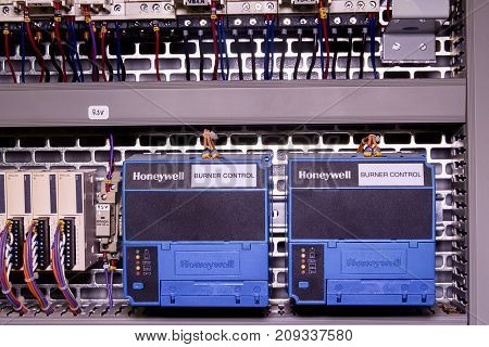 HUSTOPECE, CZECH REPUBLIC - APRIL 10, 2017: Image shows control cubicle. Honeywell electric device - burner control inside power case.
