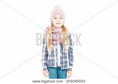 Studio portrait of little girl wearing knit hat and snood scarf