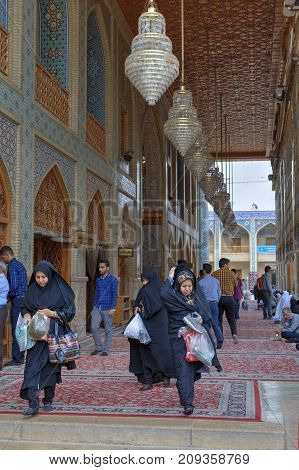 Fars Province Shiraz Iran - 19 april 2017: Shah Cheragh Shrine Iranian parishioners at the entrance to the mosque.