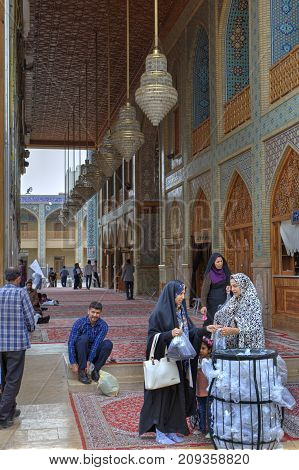Fars Province Shiraz Iran - 19 april 2017: Shah Cheragh Shrine Iranian women took off their shoes before entering the mosque.