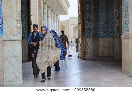 Fars Province Shiraz Iran - 19 april 2017: Shah Cheragh Shrine Muslim parishioners pass through the large gate of mosque Iran.