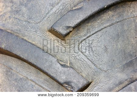 Old cracked tractor tire macro background texture