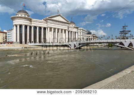 SKOPJE, REPUBLIC OF MACEDONIA - 13 MAY 2017: Skopje City Center - Archaeological Museum and Bridge over Vardar River, Republic of Macedonia