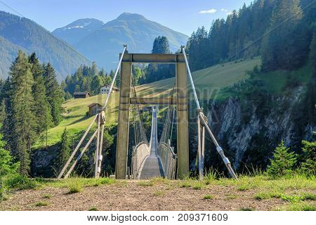 HOLZGAU AUSTRIA 18 June 2017 - Austria's longest (200m) pedestrian suspension bridge that opened in 2012 over Hoehenbach Canyon and connects Gfoellberg and Schiggenberg in Holzgau Austria.