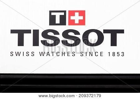 Geneva, Switzerland - October 1, 2017: Tissot logo on a wall. Tissot is a Swiss watchmaker and the company was founded in Le Locle, Switzerland