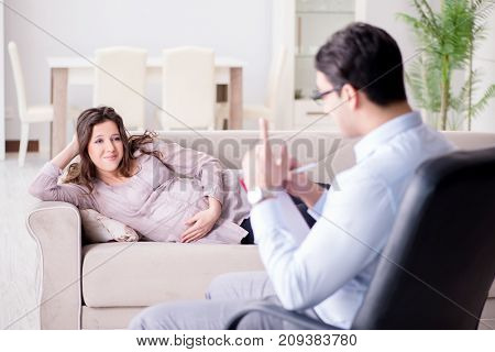 Pregnant woman visiting psychologist doctor