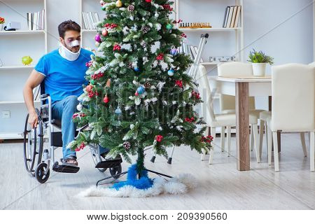 Injured disabled man celebrating christmas at home