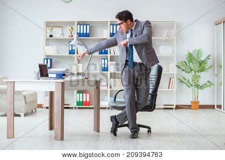 Businessman having fun taking a break in the office at work