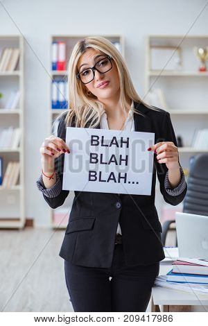 Young businesswoman with message in the office