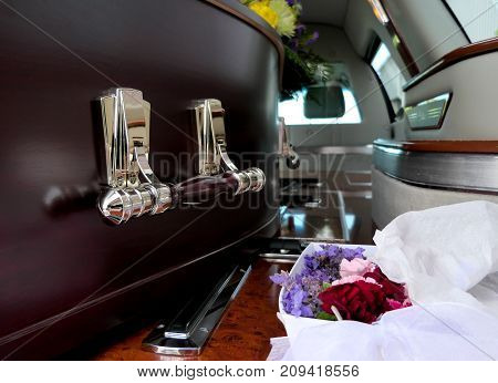 closeup shot of a colorful casket in a hearse or chapel before funeral or burial at cemetery