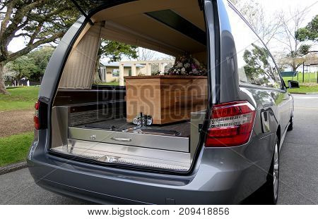 closeup shot of a colorful casket in a hearse or chapel before funeral or burial at cemetery