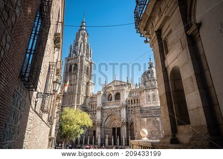 Toledo, Spain - October 13, 2017: Low angle outdoor view of the Cathedral of Toledo. The cathedral is one of the three 13th-century High Gothic cathedrals in Spain .