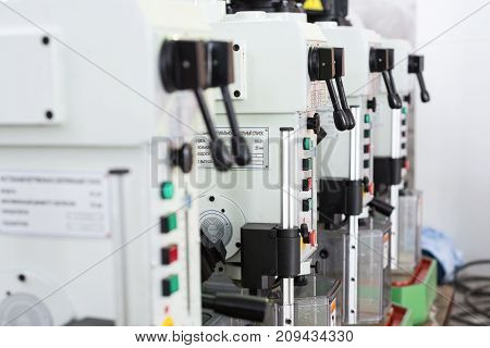 Benchtop vertical drilling machines. Black Lever Controls.