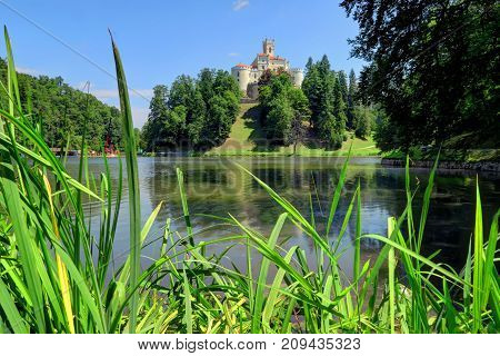 TRAKOSCAN CROATIA 28 June 2017: The sun is shining over historic Trakoscan Castle and Lake Trakoscan on June 28th 2017 in Trakoscan Croatia.