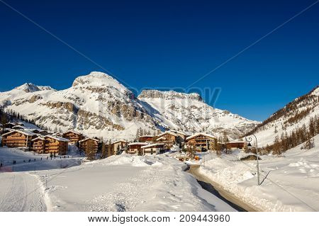 Alpine winter mountain landscape. French Alps covered with snow in sunny day. Val-d'Isere, France