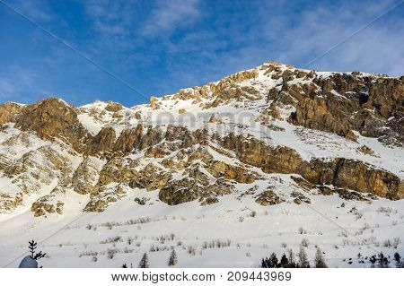 Alpine winter mountain landscape. French Alps covered with snow in sunny day. Val-d'Isere, France