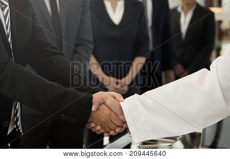 Business Partners Introductionary Handshake Bow
