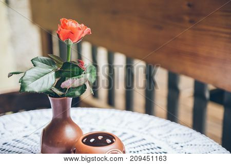 flower in vase on the table of the empty cafe