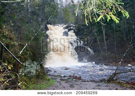 Falls in park in the Karelia, in clear summer day