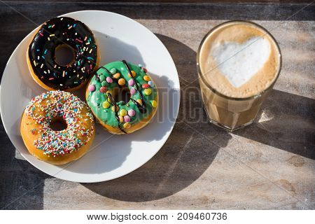 donuts on a white plate, and latte macchiatto
