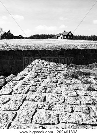 Rural house, former school, in mountain village Jizerka, Jizera Mountains, Czech Republic. Black and white image.