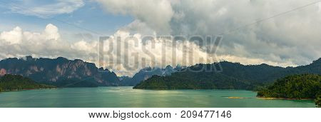 Panorama Of Lake Cheo Lan, Karst Mountains Against A Background Of Clouds
