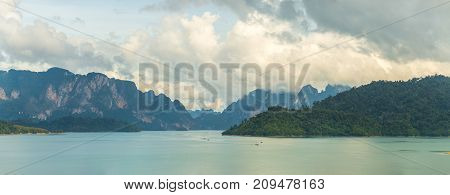 Panorama Of Lake Cheo Lan, Karst Mountains Against A Background Of Clouds