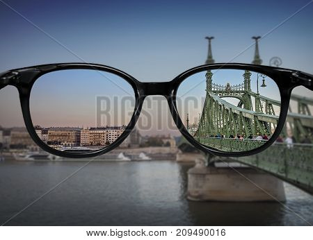 Clear Vision Through Glasses Over River Bridge Landscape