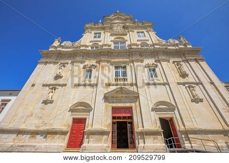 The main facade of the New Cathedral of Coimbra, Se Nova de Coimbra, is a Catholic church of Coimbra in Baroque style. Coimbra is one of the oldest university cities in Europe. Central Portugal.