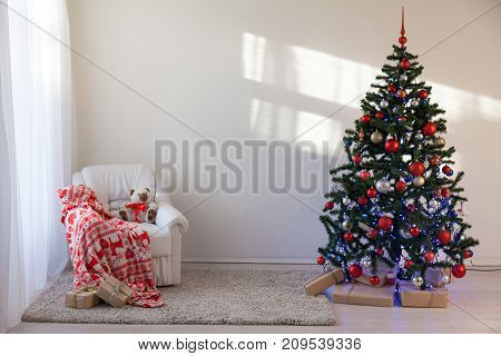 Christmas tree in a white room for Christmas with gifts 2