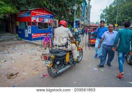 DELHI, INDIA - SEPTEMBER 25 2017: Unidentified people riding there motorbikes in the streets of Paharganj, Delhi in India.