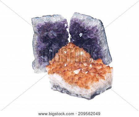 Citrine druzy cluster surrounded by amethyst druzy clusters  isolated on white background