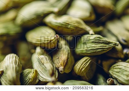 Dried green cardamom pods backdrop or texture