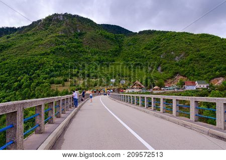 CANYON OF TARA RIVER MONTENEGRO - SEPTEMBER 12 2017: Unknown tourists are on Djurdjevic Bridge over canyon of Tara River Montenegro