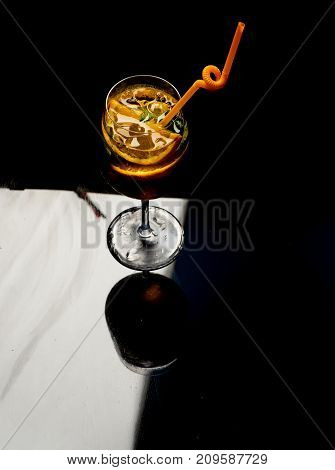 Fruit Slice And Cocktail Glass At Bar.